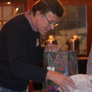 Steve Perry unwraps his selection carefully